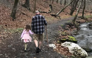 Father and daughter on hiking trail