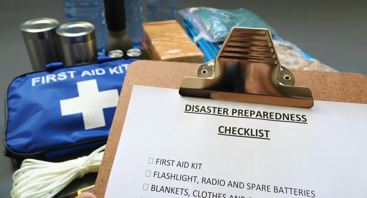 Supplies and emergency checklist to get prepared for a natural disaster.