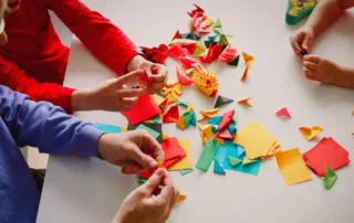 teacher and kids making origami crafts with paper, kids learning activities