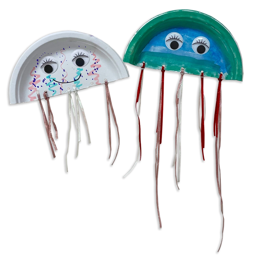Paper jellyfish decorated with markers, large googly eyes, and ribbon tentacles.