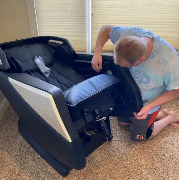 Man assembling massage chair