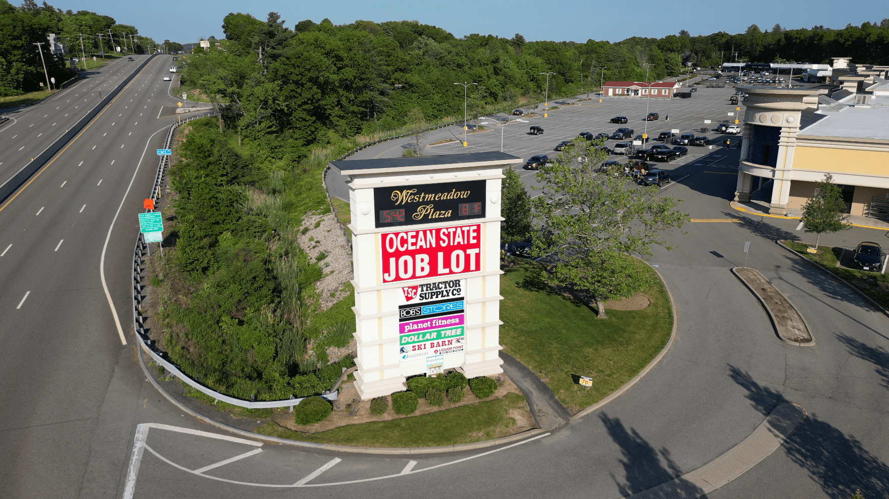 Ocean State Job Lot store plaza sign.
