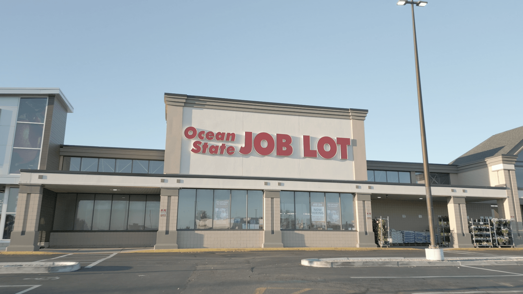 Front view of Ocean State Job Lot store with sign.