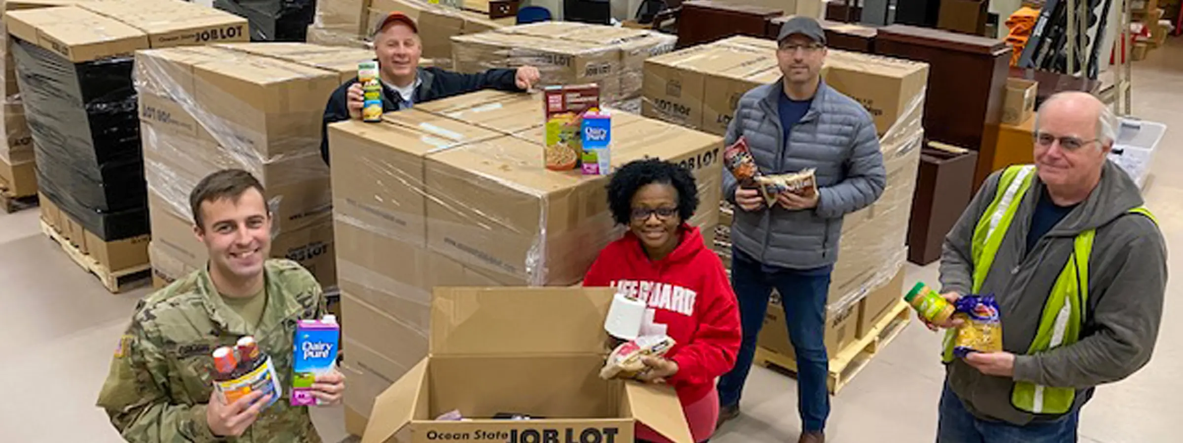 David Sarlitto, Executive Director, OSJL Charitable Foundation and others with supplies for donation.