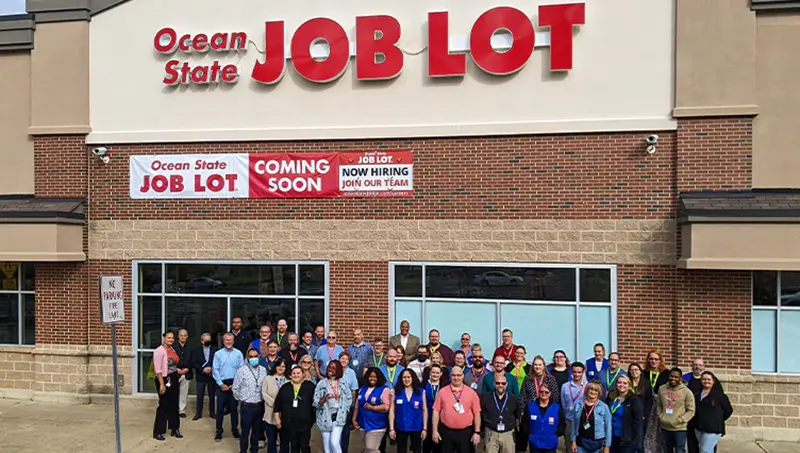 Ocean State Job Lot associates in front of a new store.