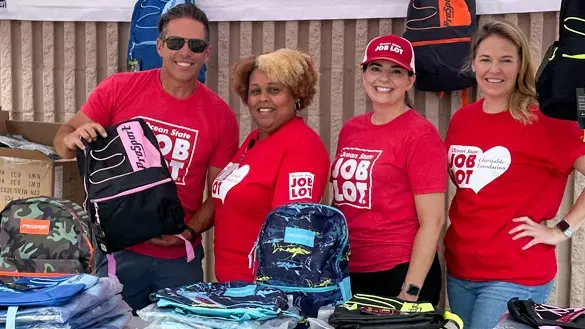 Ocean State Job Lot volunteers helping at Buy-Give-Get backpack event.