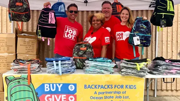 Ocean State Job Lot volunteers helping at Buy-Give-Get backpack event.
