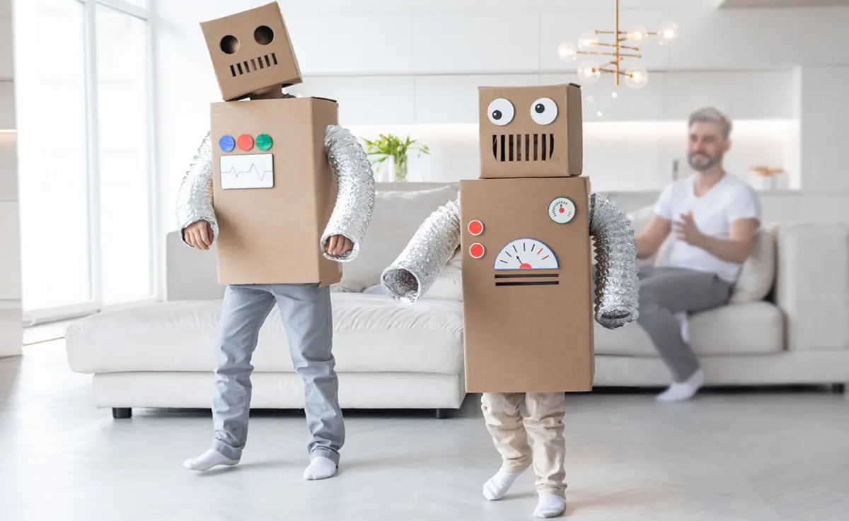 Two children in DIY robot Halloween costumes.