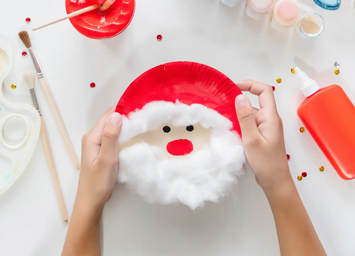 A paper plate decorated like Santa.