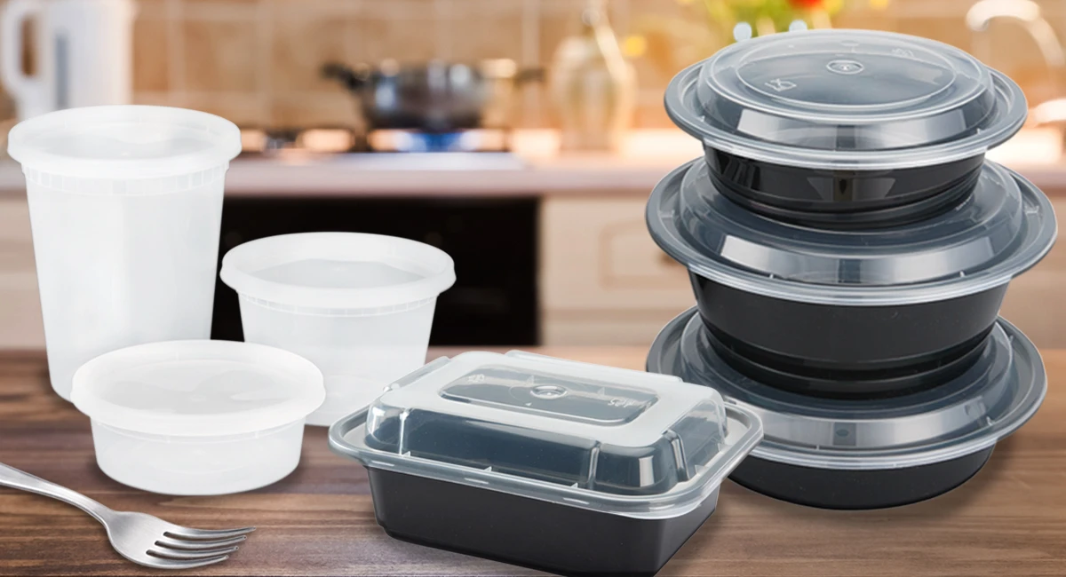 Various sizes of take out containers stacked on a kitchen counter.