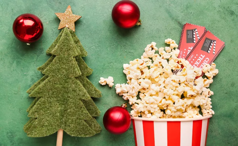 Movie tickets, popcorn, and christmas decorations.