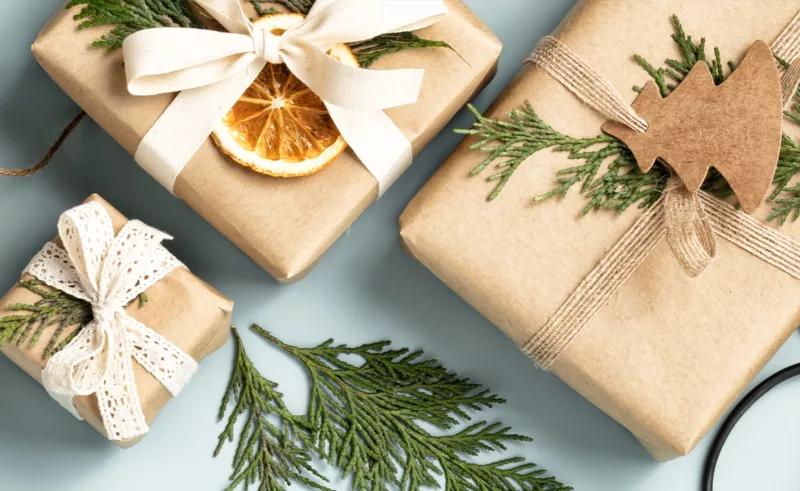 Gifts wrapped in brown paper and decorated with handmade elements.