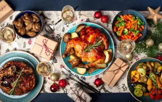 Holiday dinner table setting with food and festivities