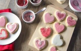 Rose-flavored Valentine’s Day sugar cookies on a plate.