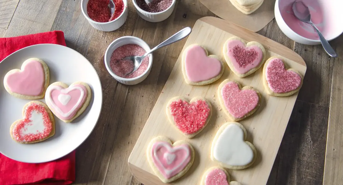 Rose-flavored Valentine’s Day sugar cookies on a plate.