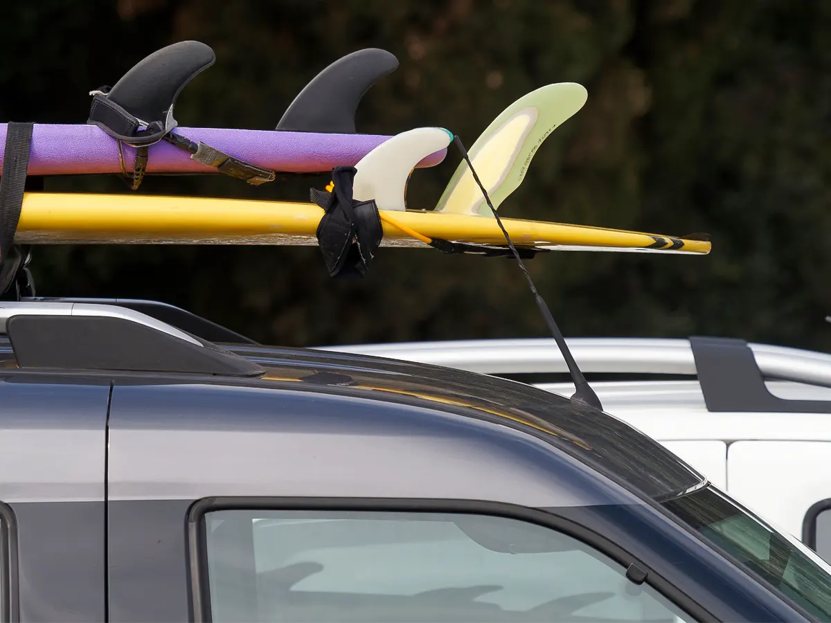 Paddleboards on top of car