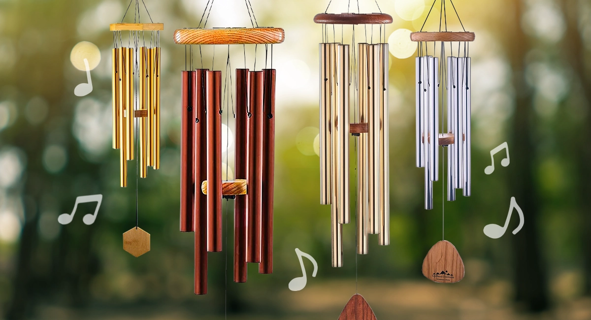 Windchimes in assorted colors hanging in a forest environment.
