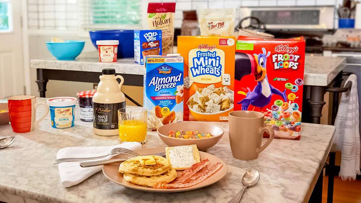 A variety of breakfast items on the table to cook including Bob’s Red Mill Flour, cereal, and Pop Tarts.