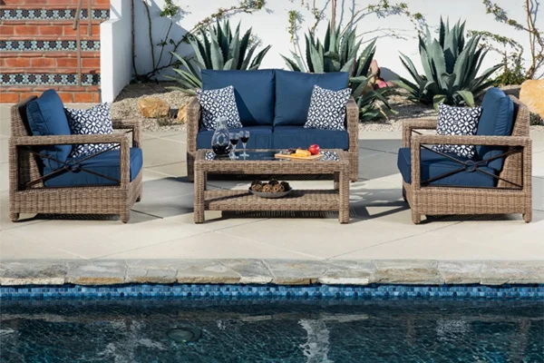 Lifestyle photo of outdoor furniture by a pool.