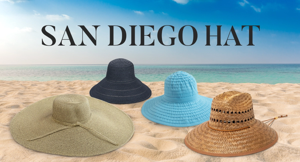 4 sun hats laying in sand on the beach