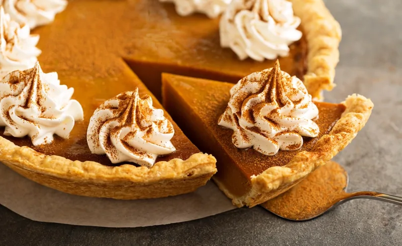 A close-up of a pumpkin pie.