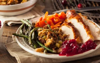 A dinner plate full of Thanksgiving foods.