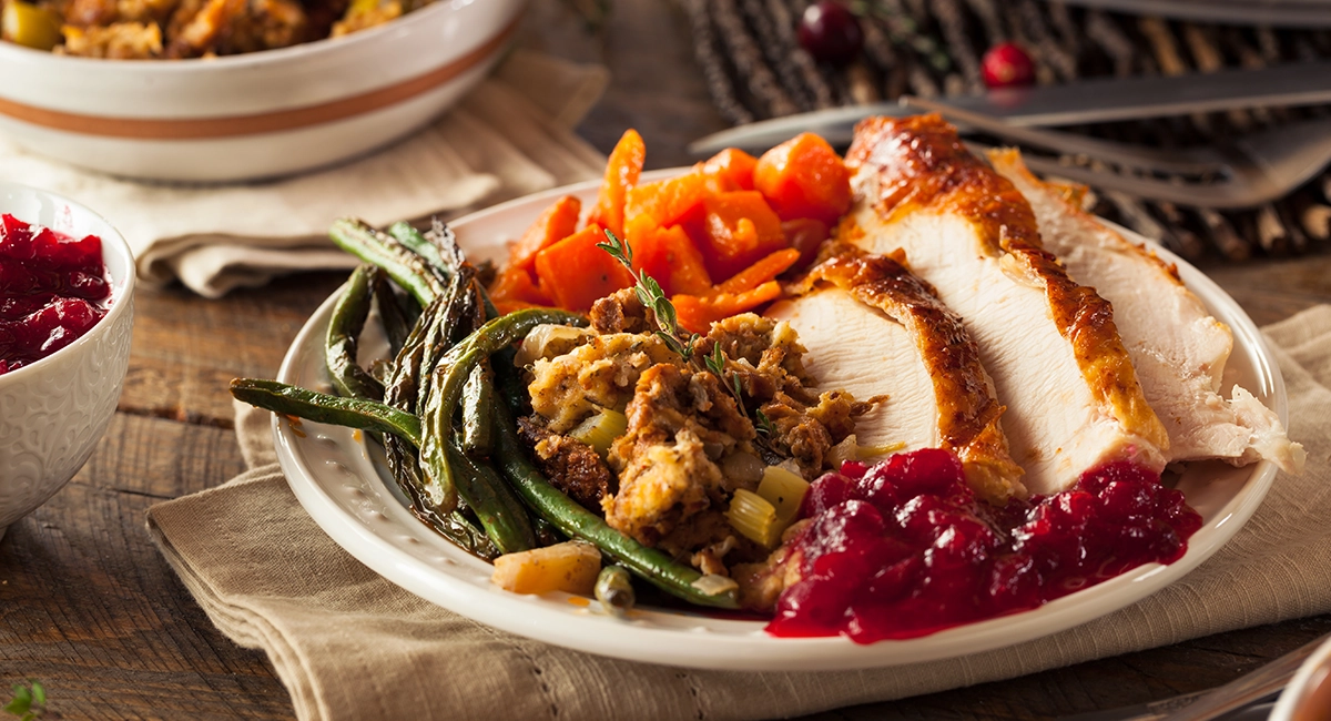 A dinner plate full of Thanksgiving foods.