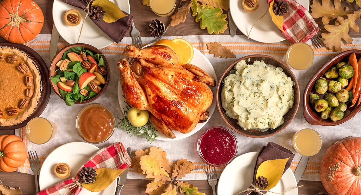 An image of a Thanksgiving Day turkey and the sides.