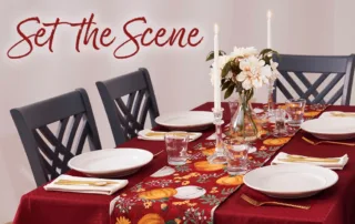 A festive thanksgiving table with 4 place settings.