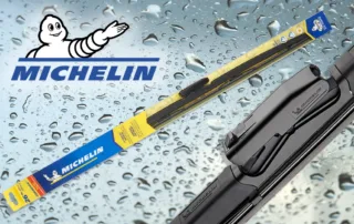 Michelin wiper blades and Michelin logo on a rainy background.