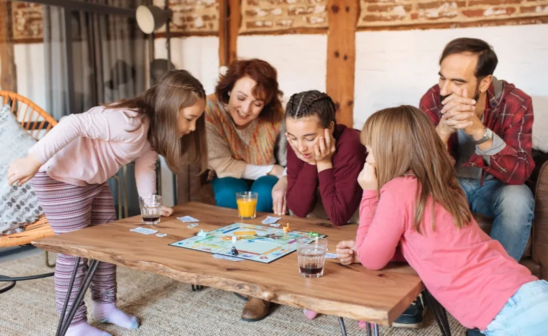 A family plays a board game.