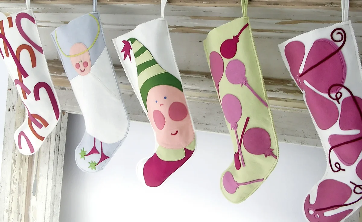 Differently themed festive Christmas stockings.