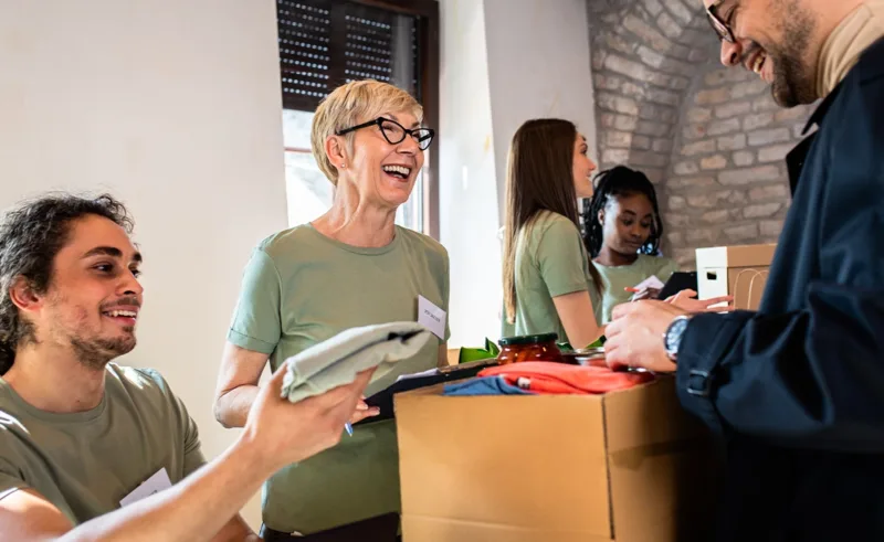 A group of volunteers collecting donations.