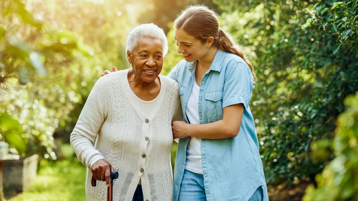 Helping_Hands_For Seniors_1200x675 Older women being helped on a walk by young woman