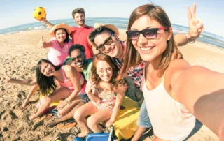 Multiracial group of friends having fun at the beach.