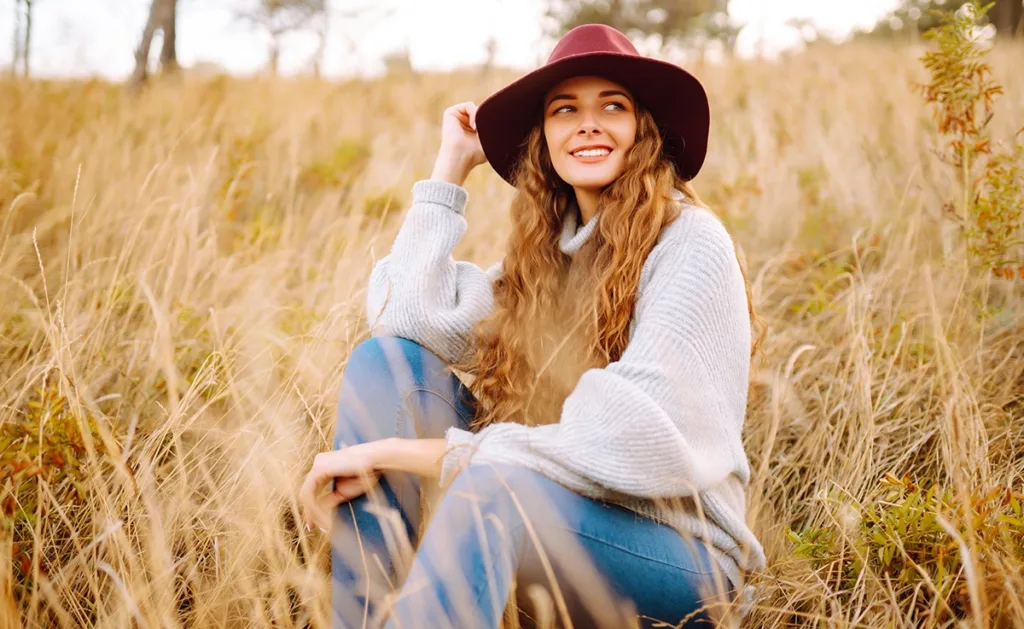 A person dressed in fashionable fall clothing.