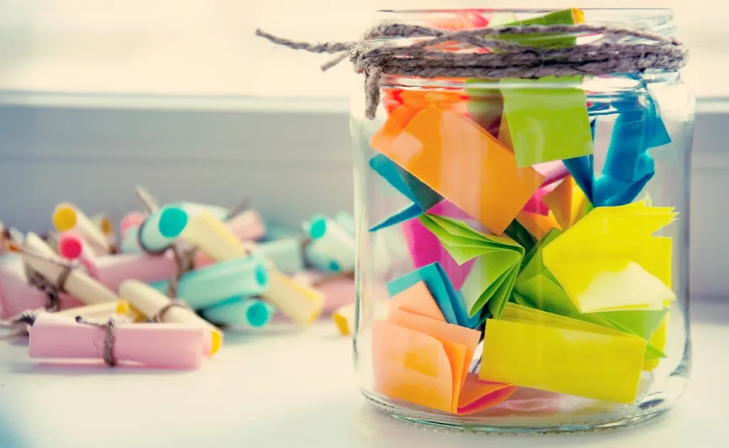 A glass jar filled with notes.
