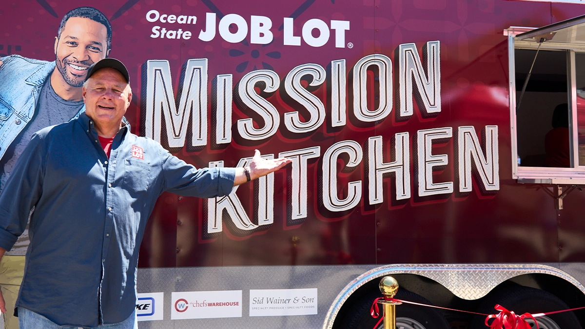 Ocean State Job Lot’s Vice President of Corporate Giving, David Sarlitto, with the Mission Kitchen food trailer.