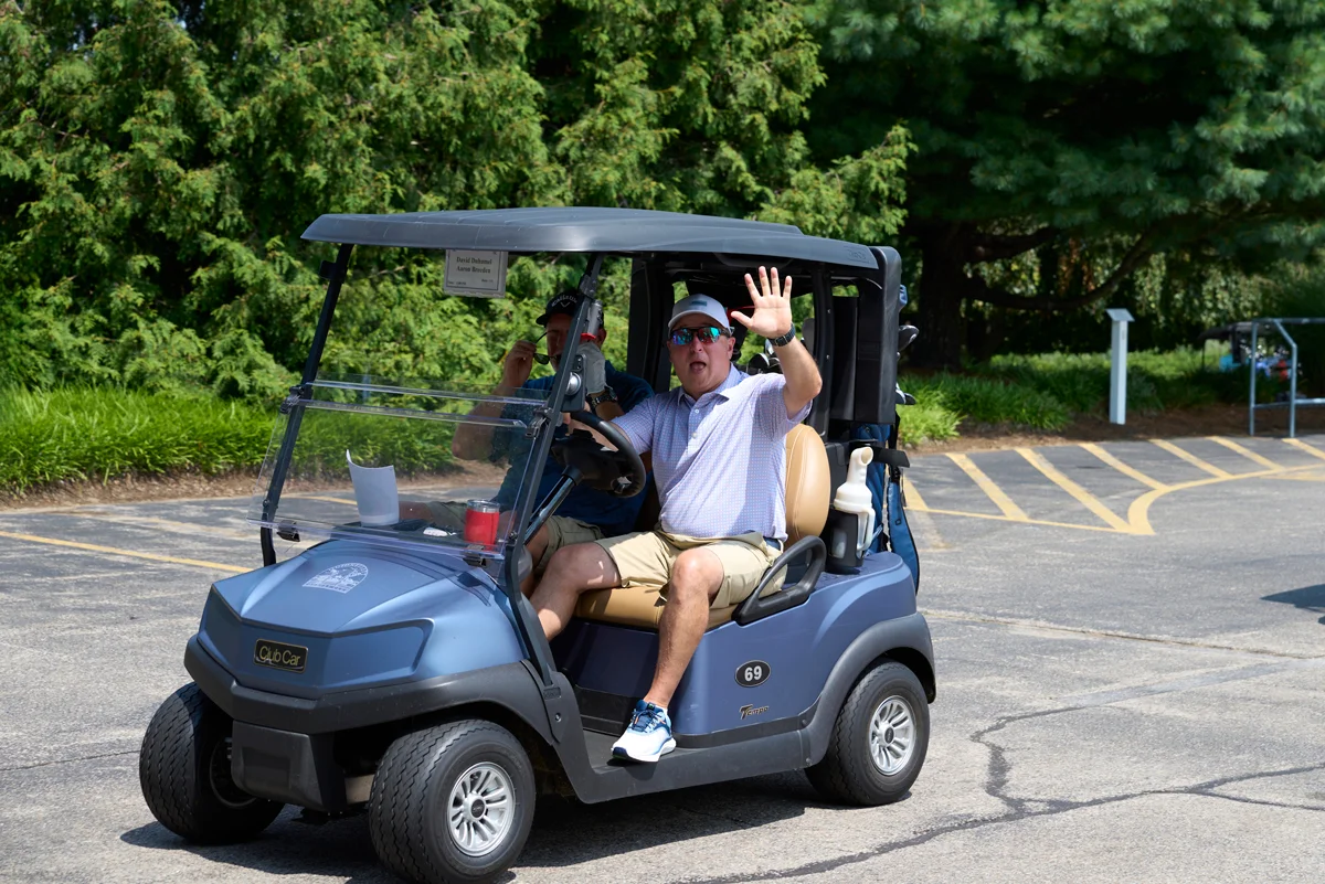 An Ocean State Job Lot golfer driving to the tee before the 22nd annual Ocean State Job Lot Golf Tournament.